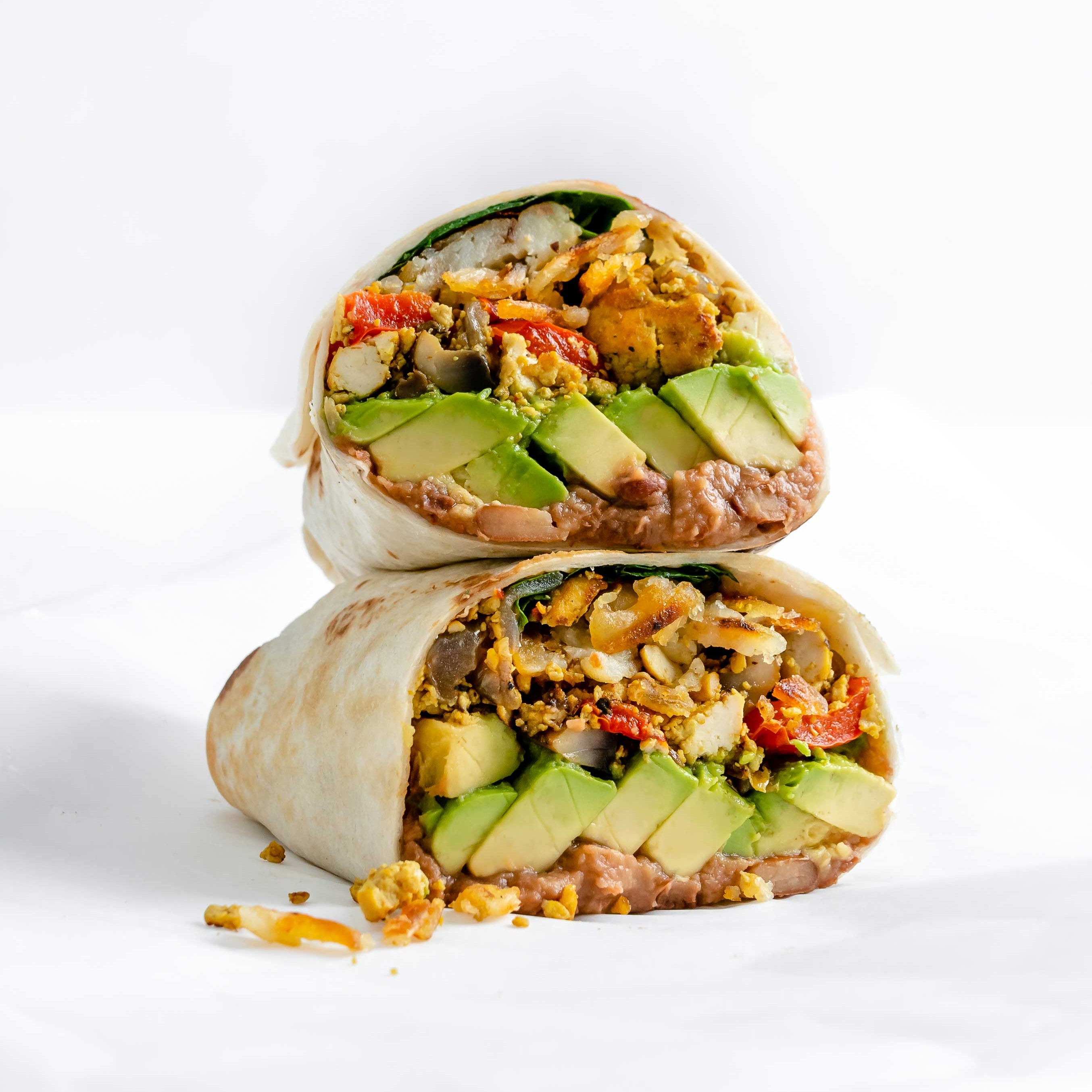 Breakfast burritos stuffed with veggies and hash browns